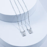 Escapulário ouro branco 18k